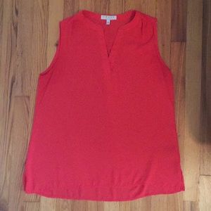 Red sleeveless blouse